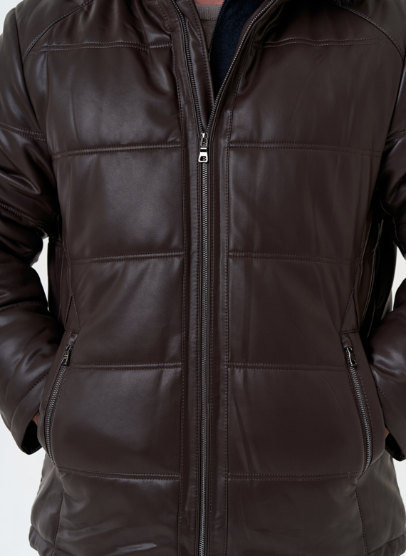 Пуховик из эко кожи с капюшоном из меха енота